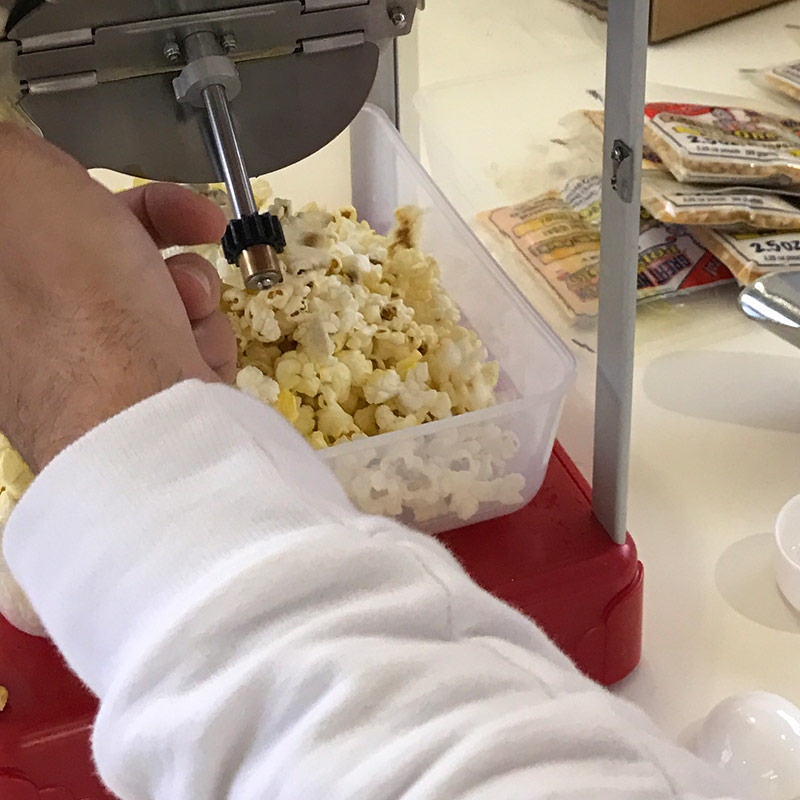 Popcorn machine popping popcorn