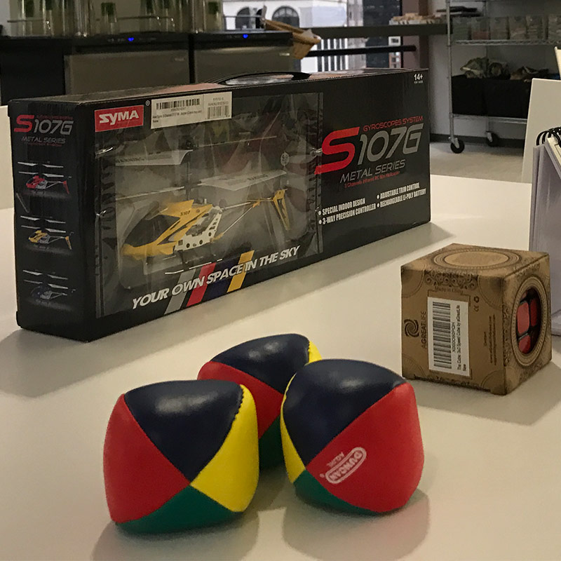 Prize table: juggling balls, rubiks's cubes, remote controlled helicopter, novelty calendar